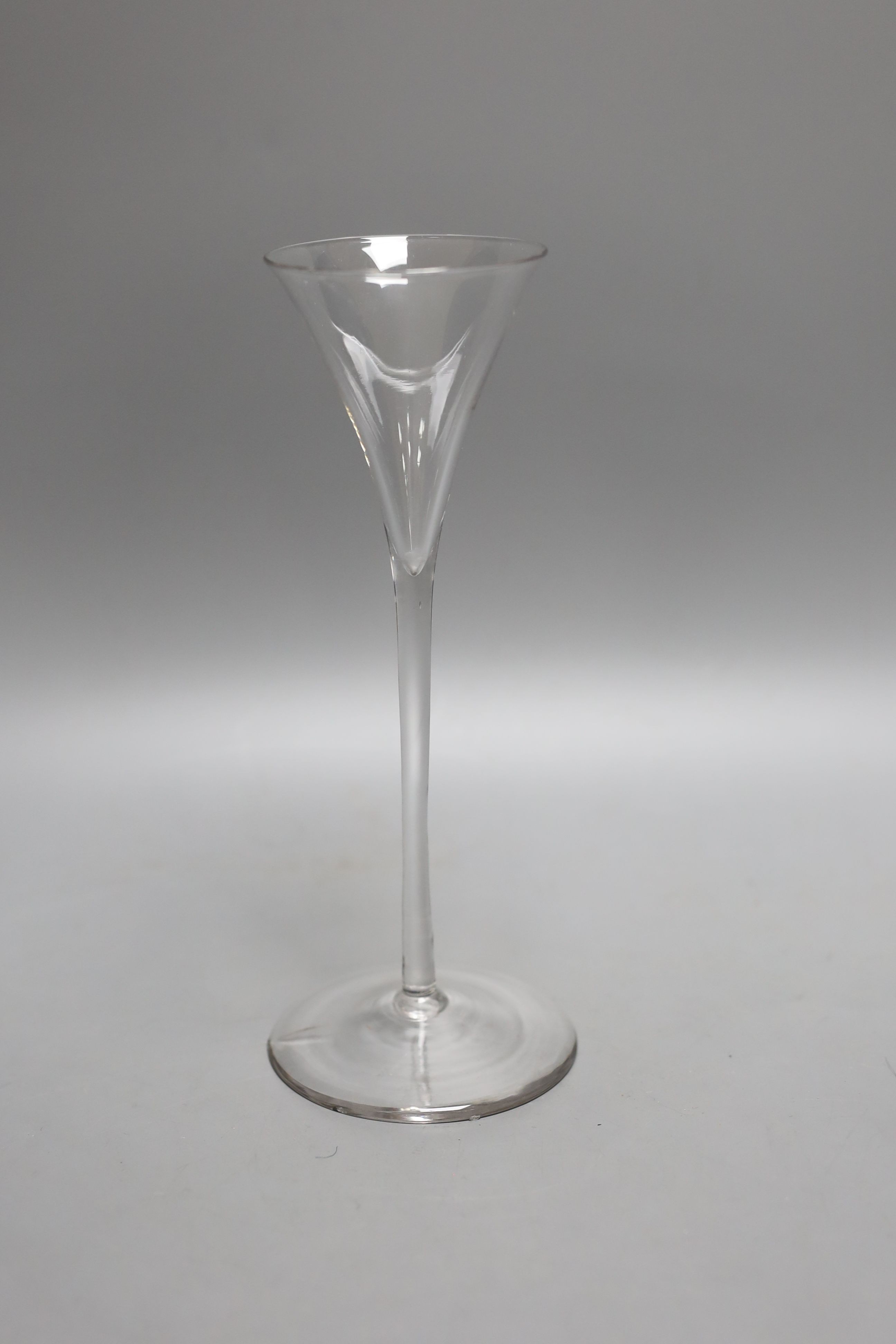 An 18th century unusually slender drawn trumpet ale glass - 20cm tall